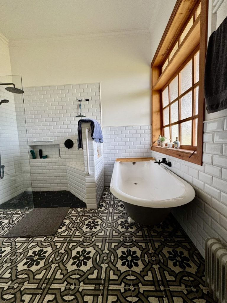Bathroom with freestanding bath in the Colonial-style home